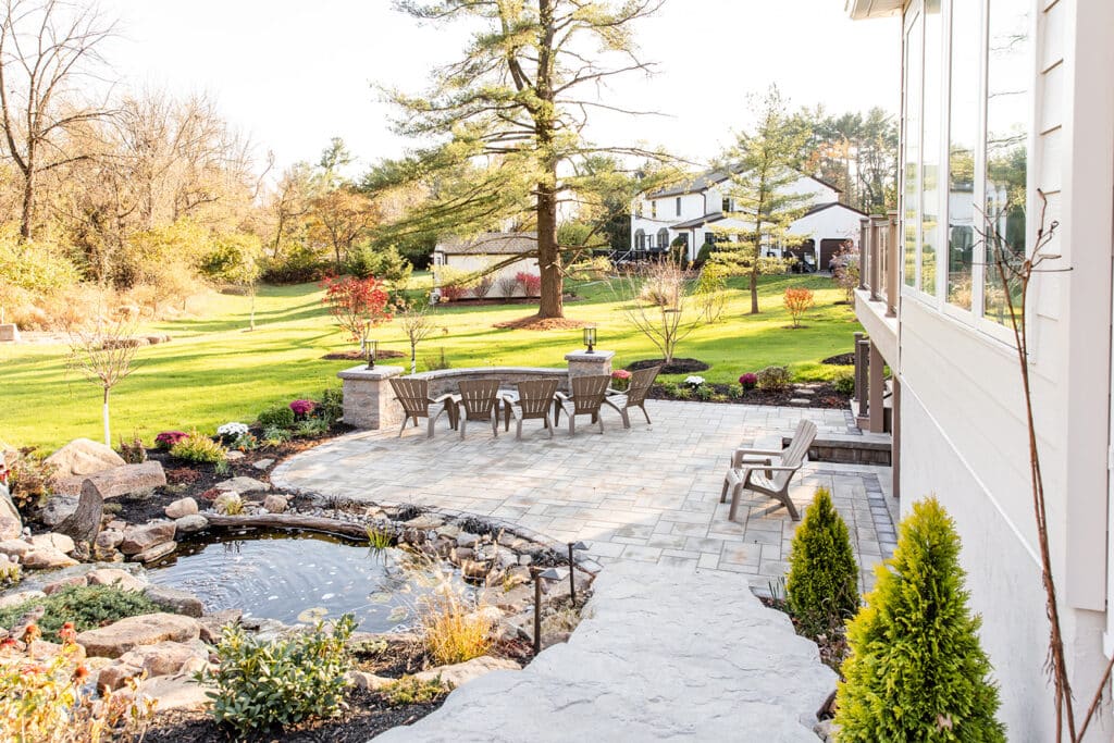 a backyard patio and rock garden hardscape installation in pa by millstream landscapes 1